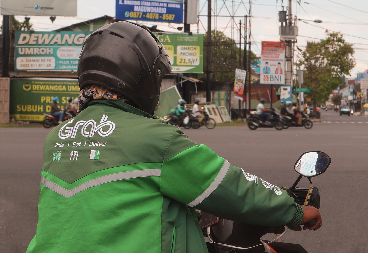 A Grab driver on a motorcycle in Yogyakarta, Indonesia