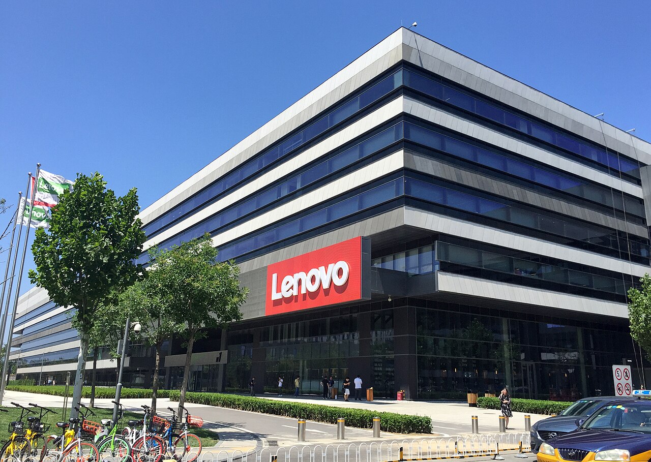 A modern Lenovo office building with the red Lenovo sign