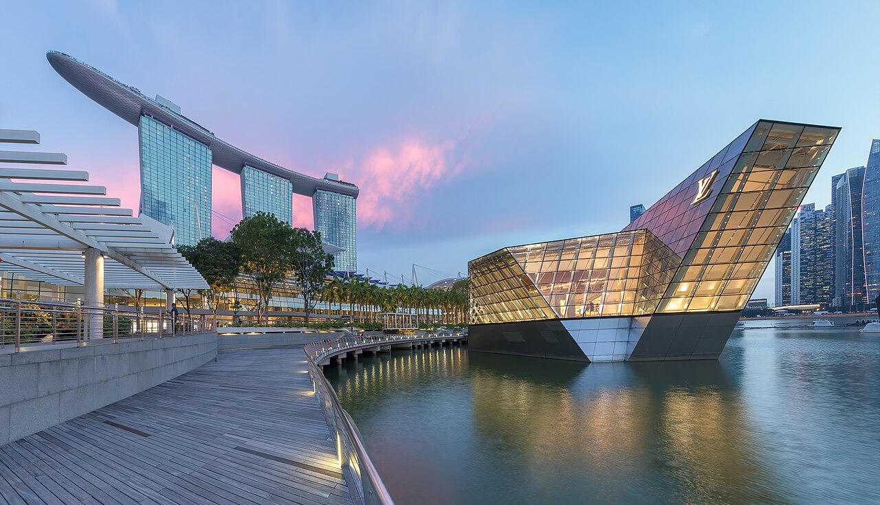 Marina Bay Sands and its SkyPark at dusk across the bay