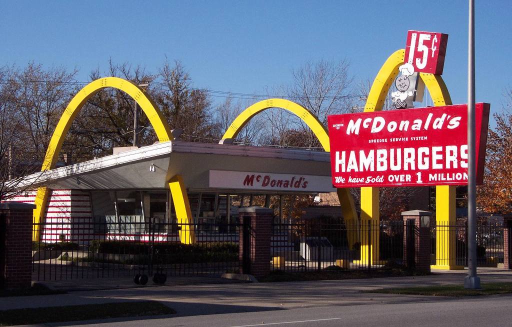A replica of an early McDonald's restaurant with golden arches