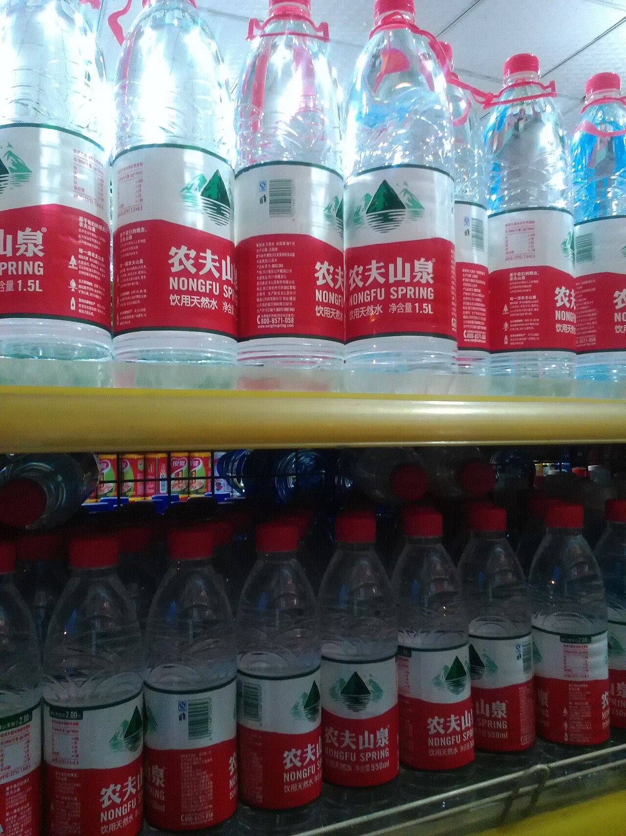 Bottles of Nongfu Spring water with red caps
