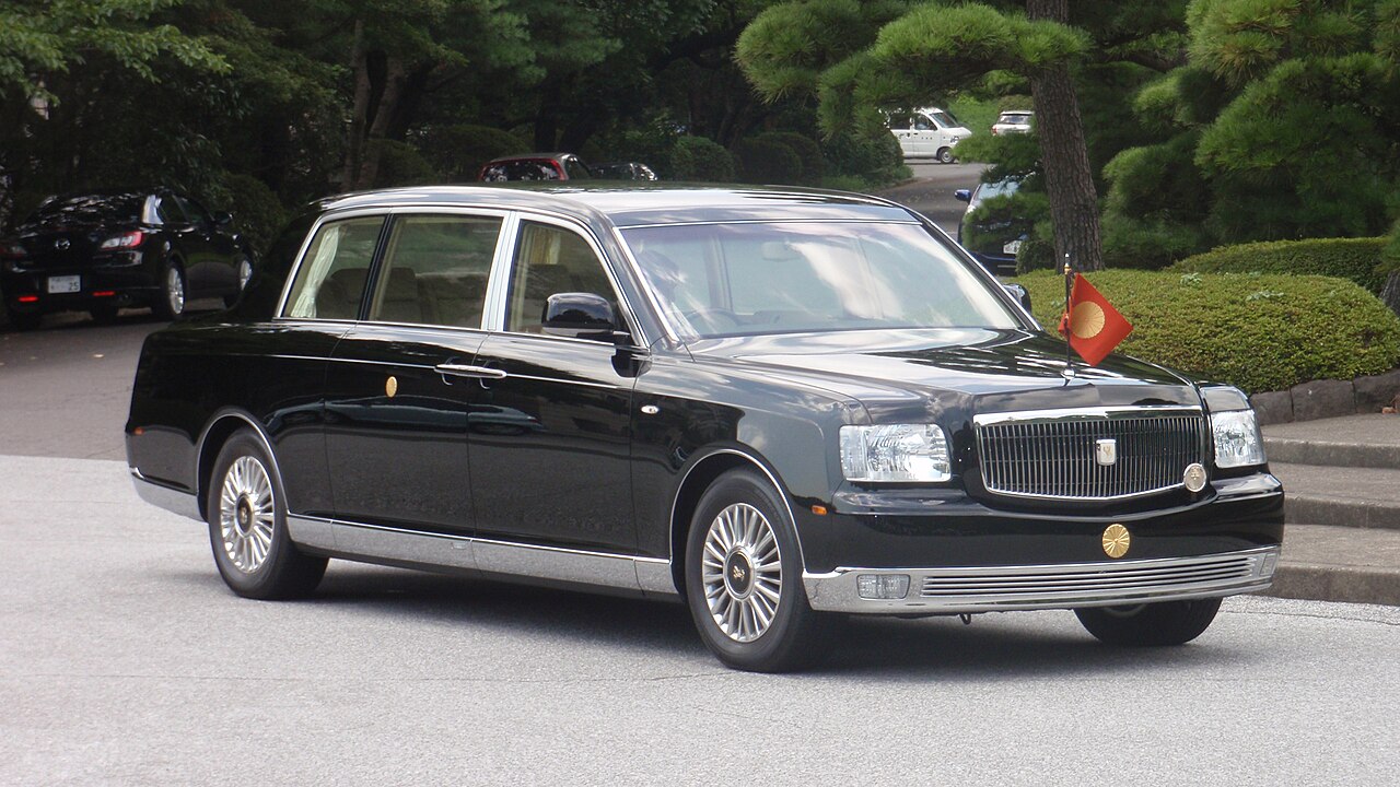 A black Toyota Century saloon parked by the roadside